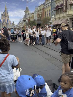 A post by @peach.mcintyre on TikTok caption: PEACH McINTYRE 🍑 LOVES 💖 TO PEOPLE WATCH 👀 ON MAINSTREET WHEN SHE GOES TO DISNEY WORLD MAGIC KINGDOM 🤩😀🤩