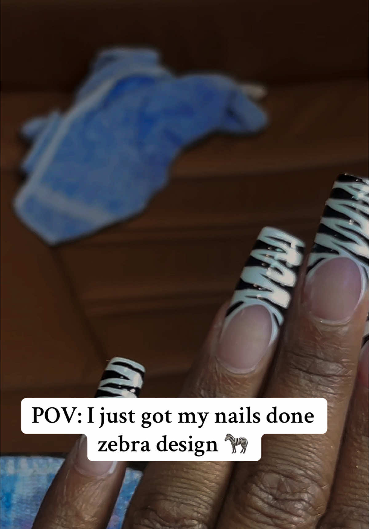 A post by @baddiejoiii on TikTok caption: #nails #zebra #fyp 