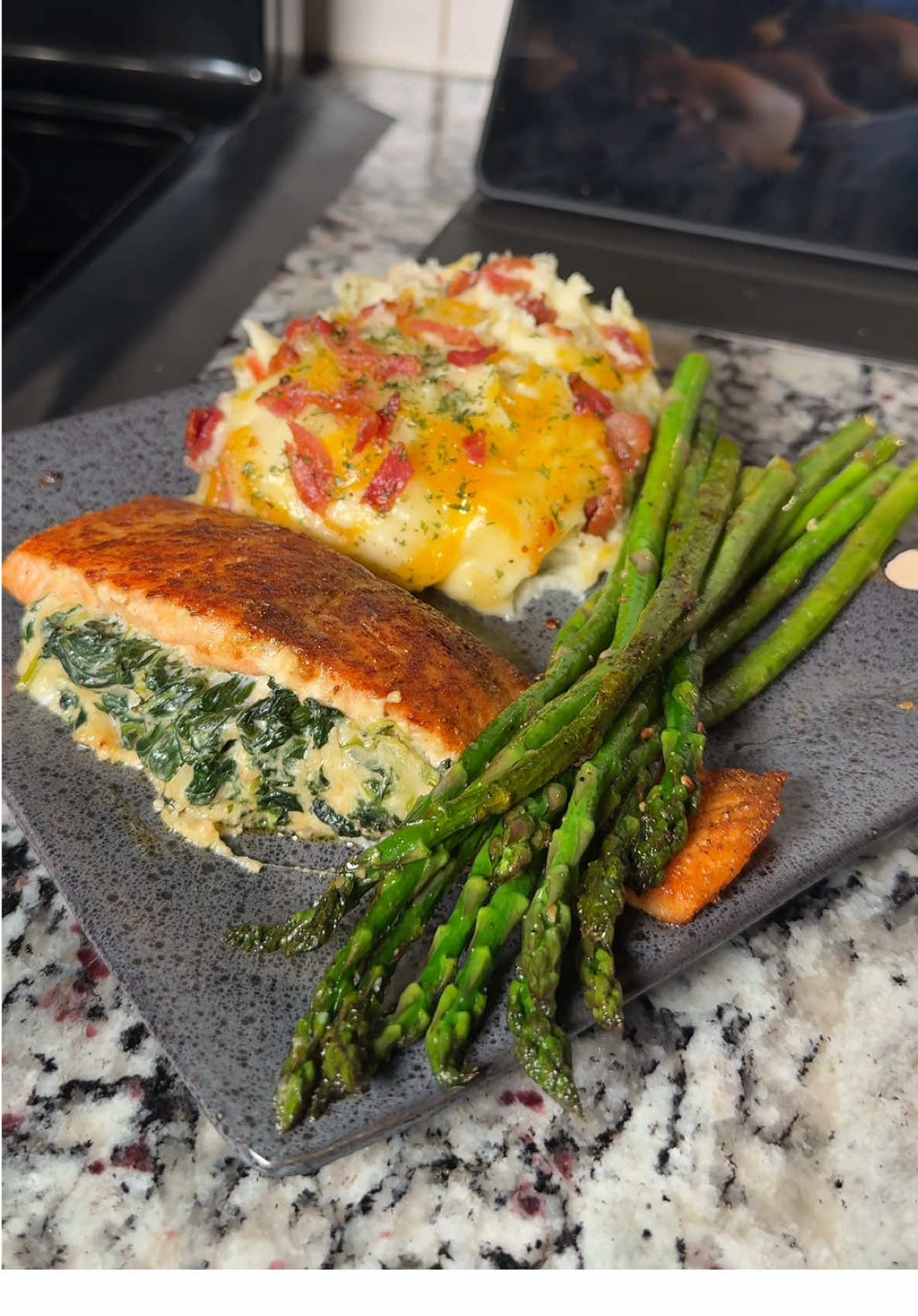 A post by @culinarychemistry on TikTok caption: Would you try this at home?  Grab the recipe and 4-minute voiceover video 👩🏽‍🍳🛒 #stuffedsalmon #loadedmashedpotatoes #mashedpotatoes #loadedpotato #salmonrecipe 