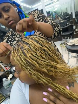 A post by @therealtati on TikTok caption: 24 hour braiding shop in NYC! #nyc #travel 