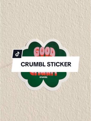 A post by @crumbl on TikTok caption: Just your luck, a new sticker just dropped! ✨ Stop by Crumbl today to grab a treat and sticker!🍀 Stickers are free—one per customer with purchase. Available in-store while supplies last! #Crumbl