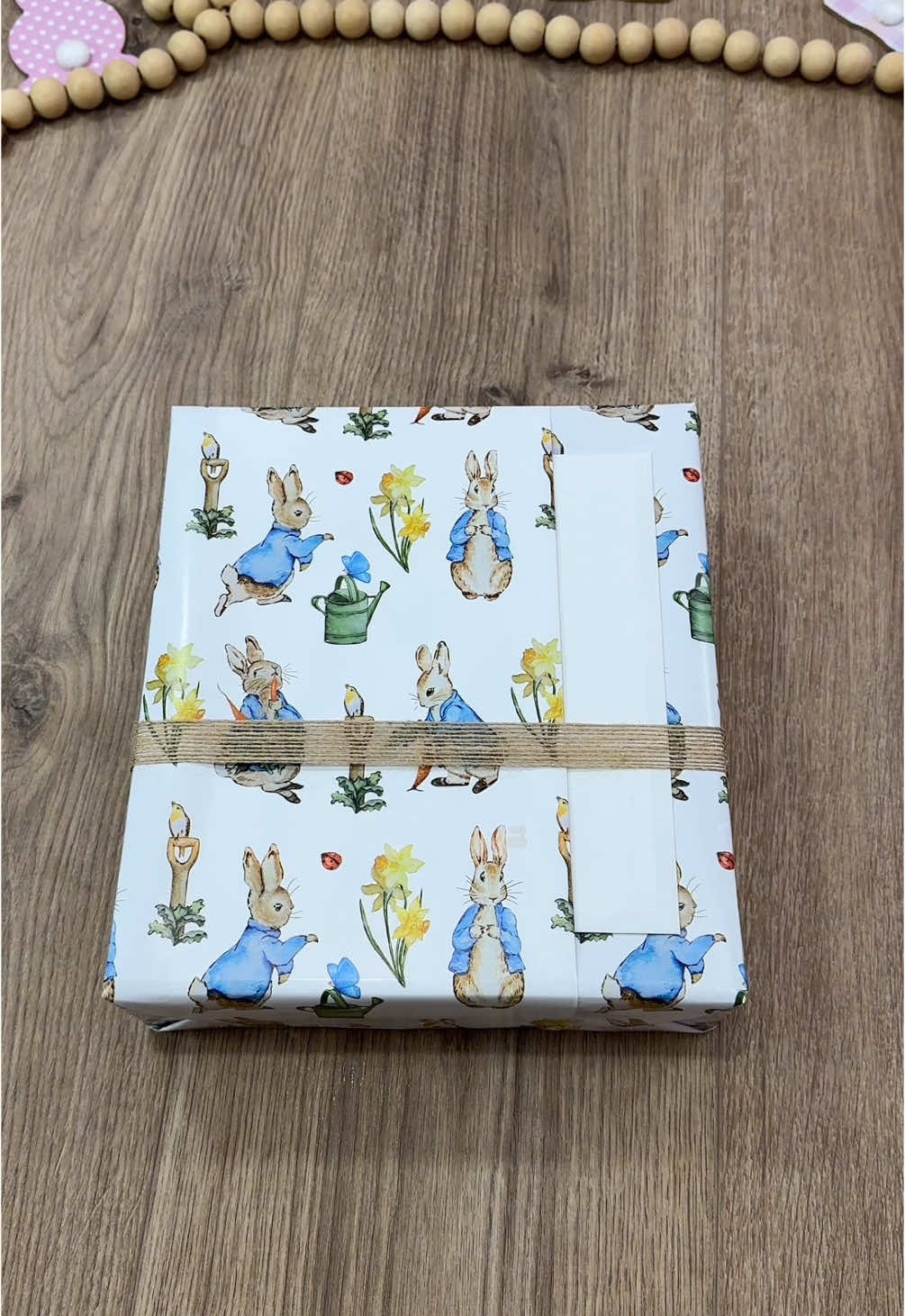 A post by @beeandblooms on TikTok caption: Super easy way to add a pocket fold to your wrapping for envelopes or cards! (Even better when the print lines up perfectly 🤩) Shoutout to @WRAPAHOLIC GIFT WRAPPING IDEA for this absolutely adorable rabbit-designed wrapping paper that I’m obsessed with!🐰 #beeandbloomswraps #giftwrapping #wrappinggifts #howtowrap #wrapaholicgifts 
