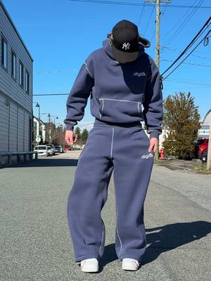 A post by @digits238 on TikTok caption: POV: you finally found the perfect navy sweatsuit 👾🦾 #fyp #clothingbrand #baggy #pants #comfort #brand #hoodie 