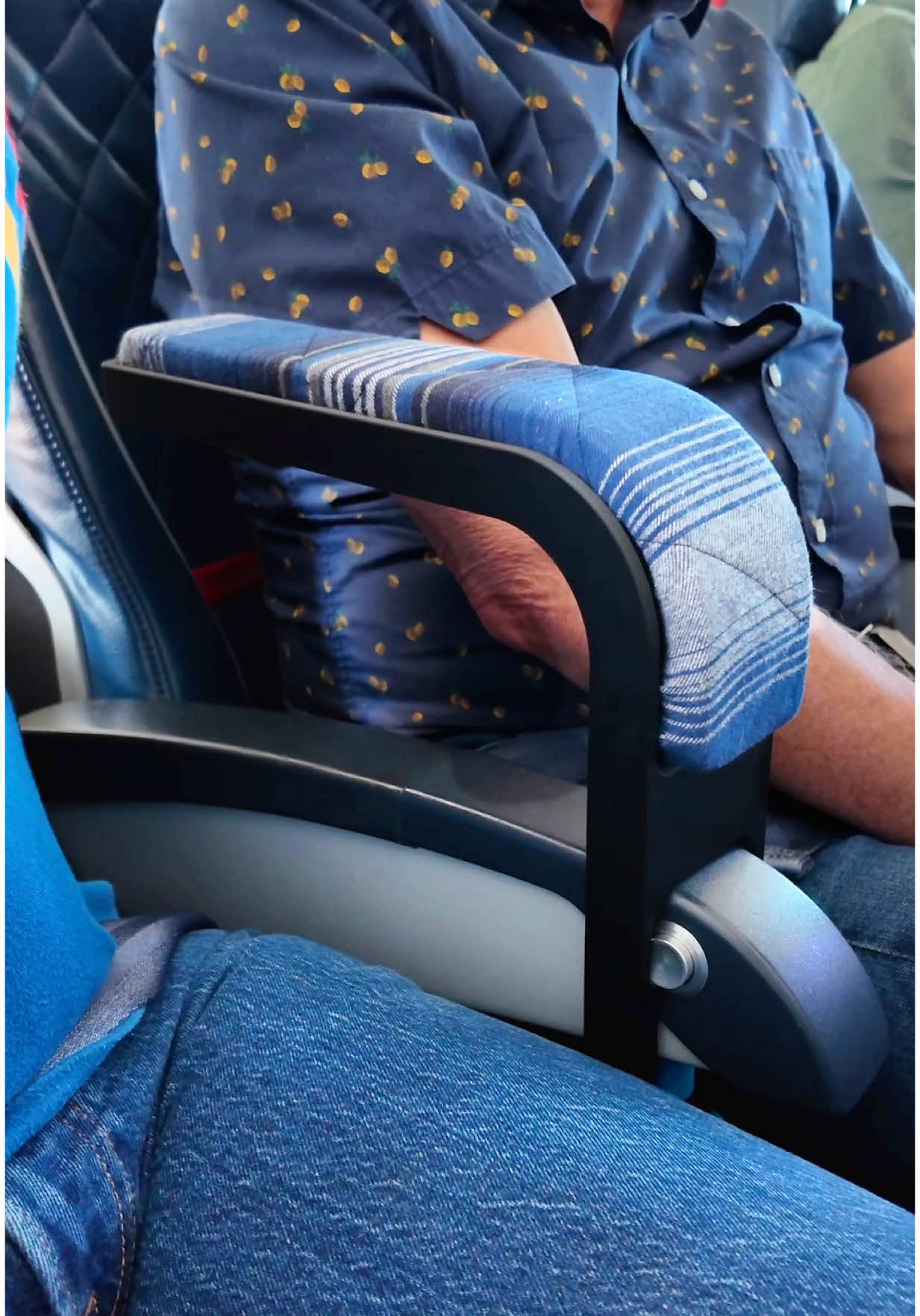 A post by @unnecessaryinventions on TikTok caption: I got tired of fighting over elbow space on my flights. #unnecessaryinventions 