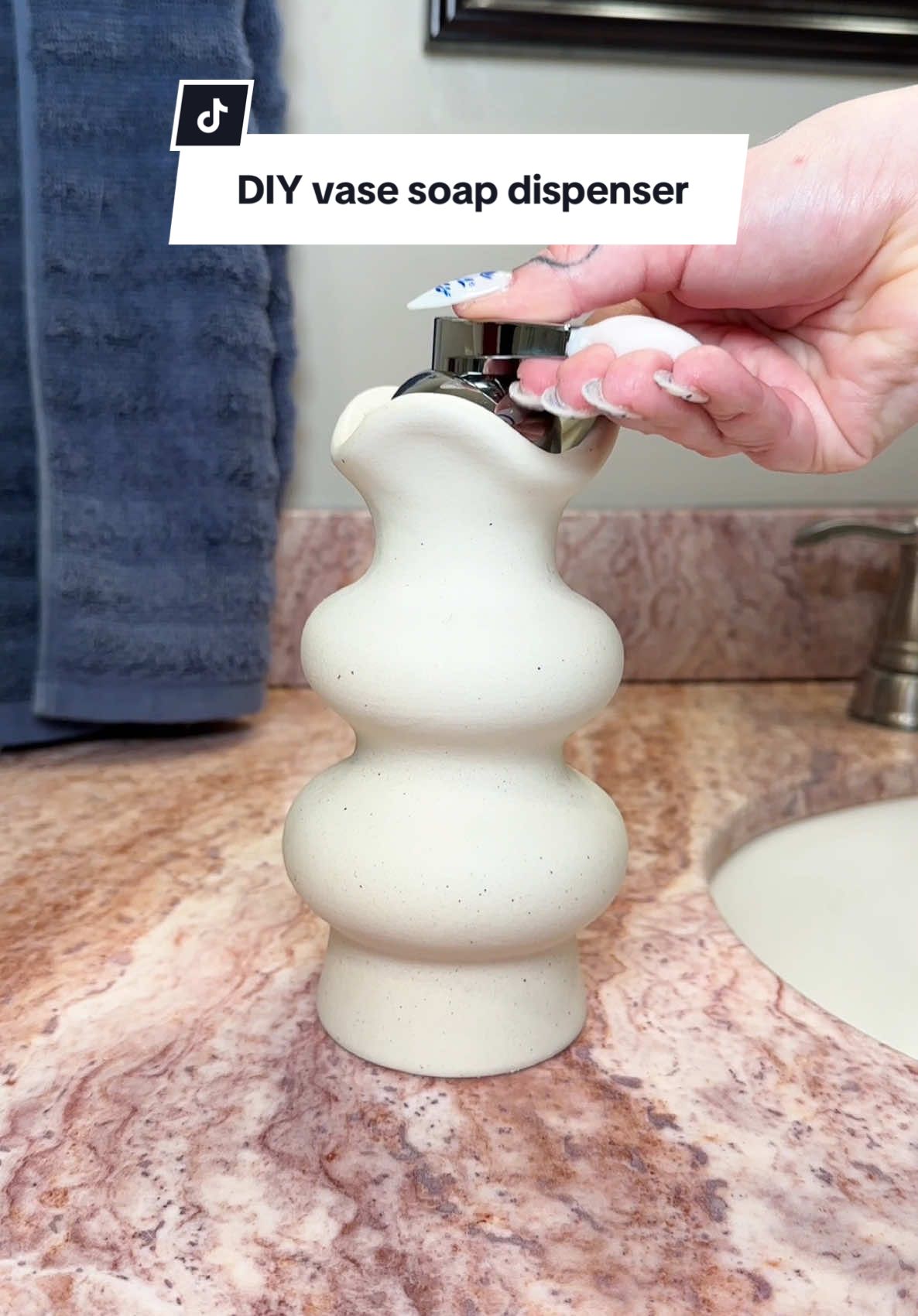 A post by @emilyrayna on TikTok caption: Easy DIY soap dispenser made from a vase! #diyhomedecor #bathroomdecor #homedecor #budgetfriendly #soapdispenser 