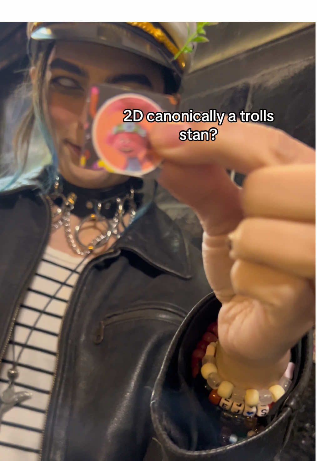 A post by @juststuart23 on TikTok caption: left a poppy behind at the rave venue for good luck #gorillaz #trolls #2dcosplay #edm #ravetok #rave