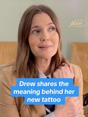 A post by @thedrewbarrymoreshow on TikTok caption: Replying to @Marilyn Taina Martinez Drew shares the meaning behind her new tattoo! #drewbarrymore #tattoo 