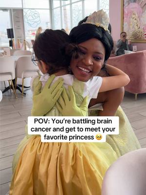 A post by @charlie on TikTok caption: I’m not crying 🥲🥹💚 Cafe Lola making dreams come true! Thank you @Alexandra Lourdes for making this happen✨ #princess #princessandthefrog #princesstiana #cafelola #vegas #bekind #cancerwarrior #disney 