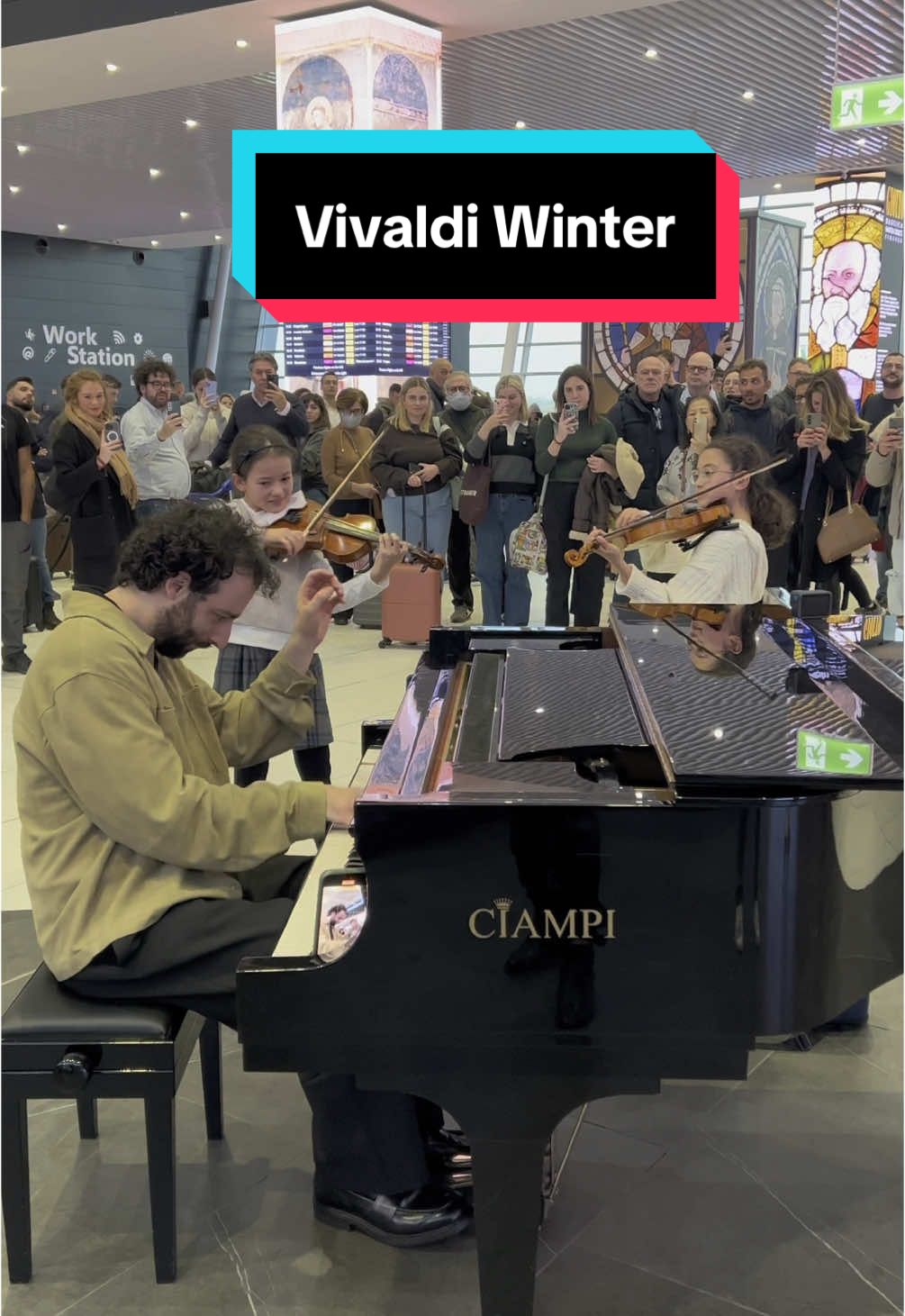A post by @juliencohen_piano on TikTok caption: 11 and 8-year old PRODIGY SISTERS played Vivaldi Winter with me on the violin in @Rome Airports  They were SO CUTE AND AMAZING.. the whole airport loved it 😍  #vivaldi #fourseasons #winter #vivaldiwinter #childprodigy #violin #sisters 