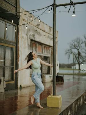 A post by @tbaphotography on TikTok caption: | SENIOR MIRANDA |  Senior session in the rain only happen once in a life time, so why not make it the best there is…  Let’s just say we didn’t check the weather before this session. LESSON LEARNED, but after this sessiom give me all the rainy day sessions.  Whenever we seen weather in the forecast we didn’t let that put a damper on our mood nor the session. We rolled with the punches and made the best of it.  I can say that this is by far the BEST senior session yet! Miranda didn’t let the weather get her down instead she embraced it all from the high winds,wet clothes and heavy rain.  #Senior2025 #seniorphotographer #seniorsession #dancinginthestreet #dancingintherain #texasphotographer #photography #weather #storm #photographyeveryday #classof2025 #2025Ready #photo #doitanyway #smile