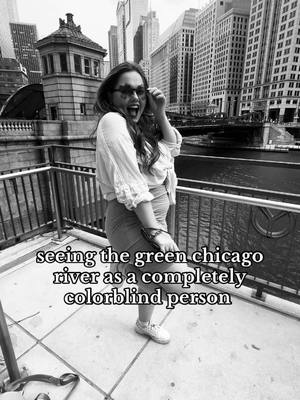A post by @natashac44 on TikTok caption: Should I show y’all in color!? ☘️ #Achromatopsia #Colorblind #Blindness #Blind #Chicago #ChicagoRiver #StPatricksDay #Green #Accessibility #Travel #ForYou #FYP 