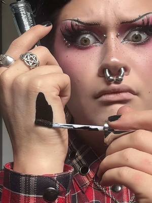 A post by @motherof.hades on TikTok caption: @Makeup A Murder, INC. KISS OF DEATH LIP STAINS 🩸🔪 the pigment in these are unreal! Use code ‘hades’ for $$$ off #goth #gothmakeup  #motherofhades #facepiercings #foryou #fyp #trending   #stretchedseptum #stretchedears #makeupamuder #lipstain #lipstainviral 
