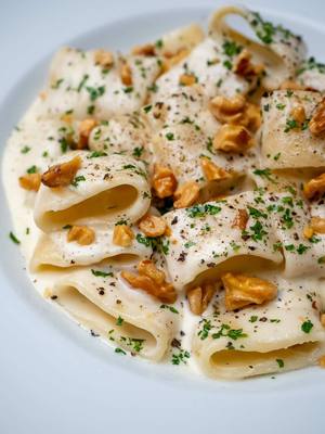 A post by @breadbakebeyond on TikTok caption: Four Cheese Pasta I’ve been making this pasta since I was a teenager, it was one of the first recipes I ever tried. Over time, I’ve tweaked it, swapping cheeses and adding toasted walnuts for some crunch, plus a bit of parsley to freshen it up. It’s simple, rich, and still one of my favorites. Creamy pasta recipe Italian food Easy homemade pasta  Cheesy pasta dish Easy dinner recipe  Four cheese pasta recipe #pastalover #italianfoodie #homecooking #weeknightdinner #italianfood 