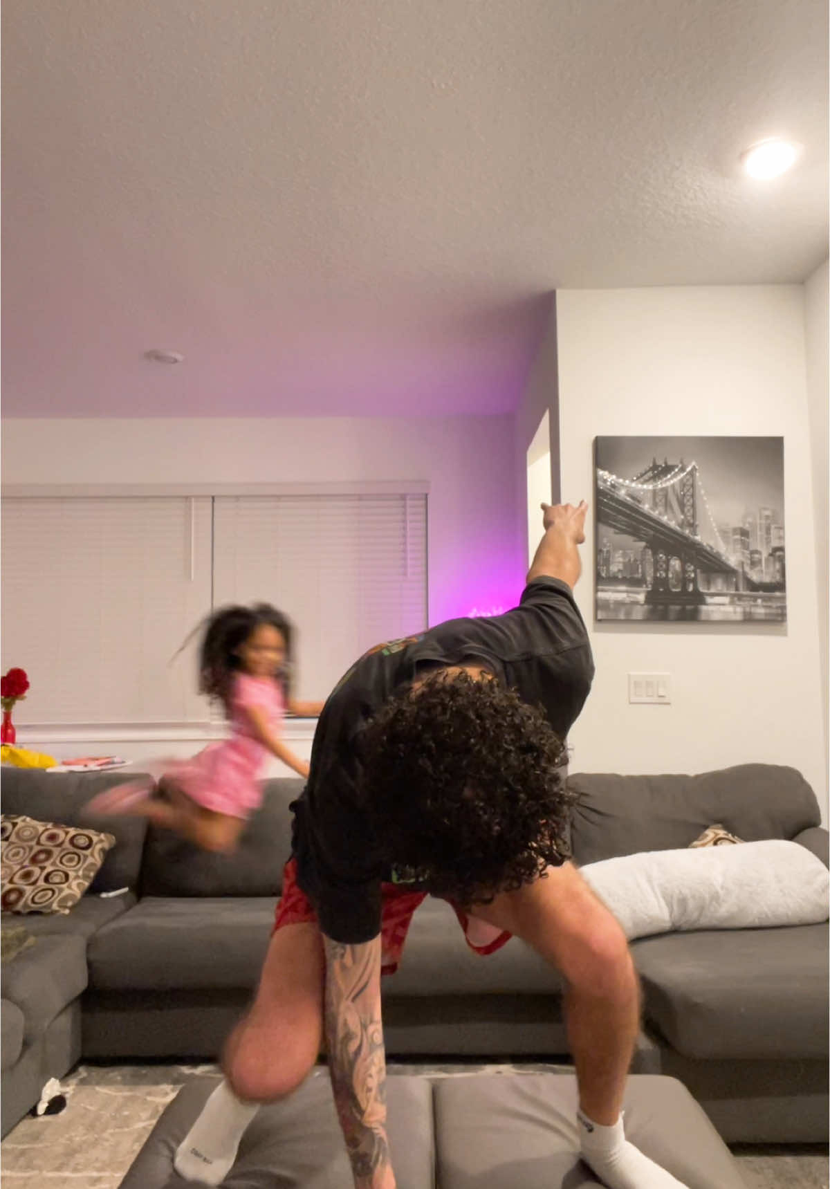 A post by @treyrockefella on TikTok caption: her lil super man jump 😭🥰