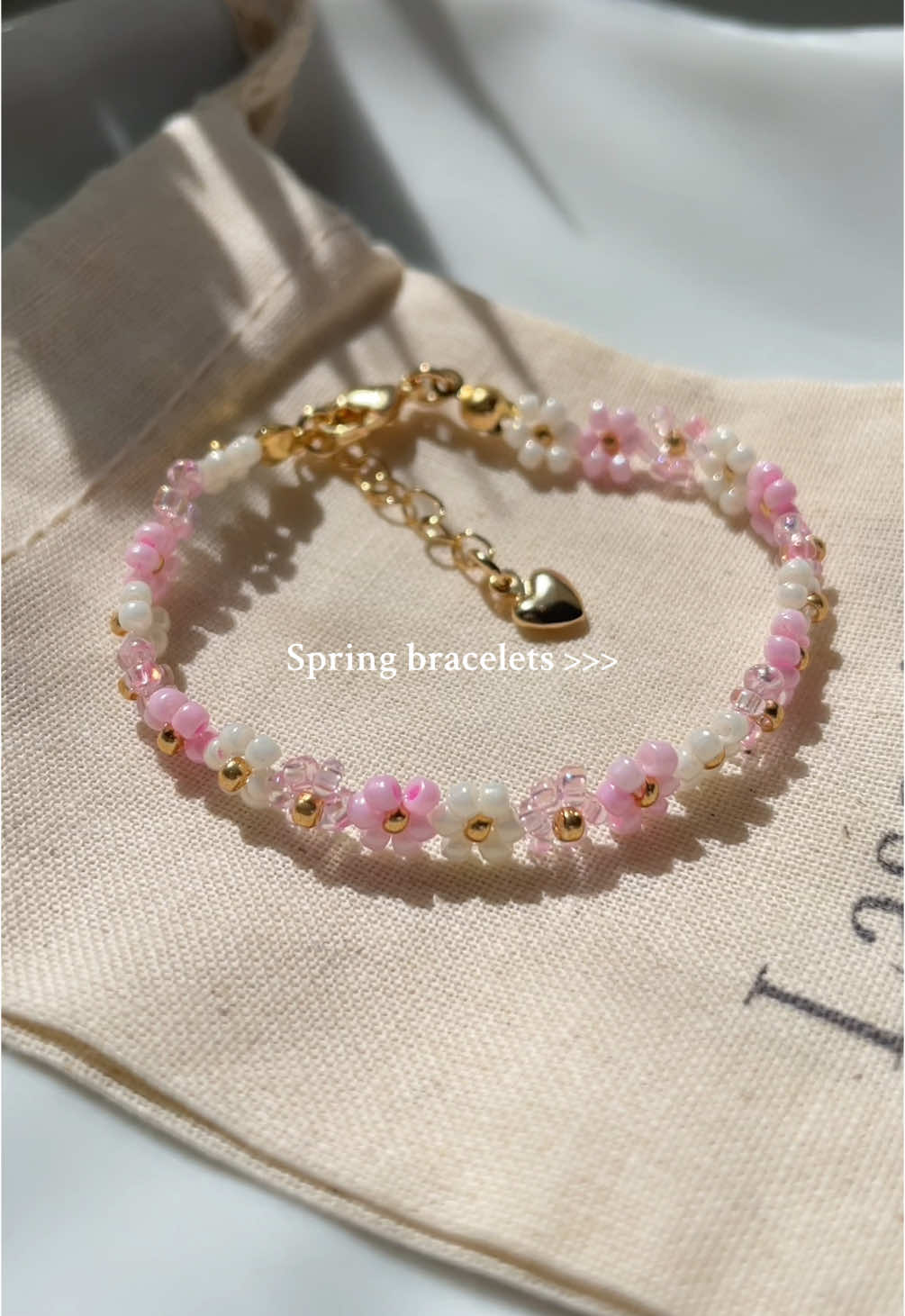 A post by @bijouxlasotita on TikTok caption: Happy Spring!🌷🌸🎀✨ All our jewelry available at Bijouxlasotita.com 🤍✨ #SmallBusiness #handmadejewelry #handmadejewelrybusiness #beadedjewelry #beadedbracelets 