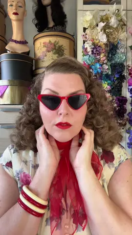 A post by @hollandschmeisje on TikTok caption: First 20C day of the year ☀️ I was In the mood for super fluffy hair! Have a great Friday 💋 Dress very old Hellbunny Bangles & sunnies @Bow & Crossbones lippy is vintage starlet @Dafna Beauty shoes are @Memeryshoes bag is #truevintage #vintagehair 