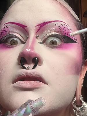 A post by @motherof.hades on TikTok caption: peep the NEW MOTHER OF HADES 💕hand mirror💕 eeee! @𝔇𝔯𝔬𝔭𝔇𝔢𝔞𝔡𝔊𝔬𝔯𝔤𝔢𝔬𝔲 @NYX Professional Makeup @Makeup A Murder, INC. @Ask & Embla #goth #gothmakeup   #tradgoth #tradgothmakeup #pinktradgoth  #motherofhades #pink #pinkmakeup #leopardprint #leopardprintmakeup #stretchedseptum #stretchedears #facepiercings #ladygaga #artpop @elfcosmetics 