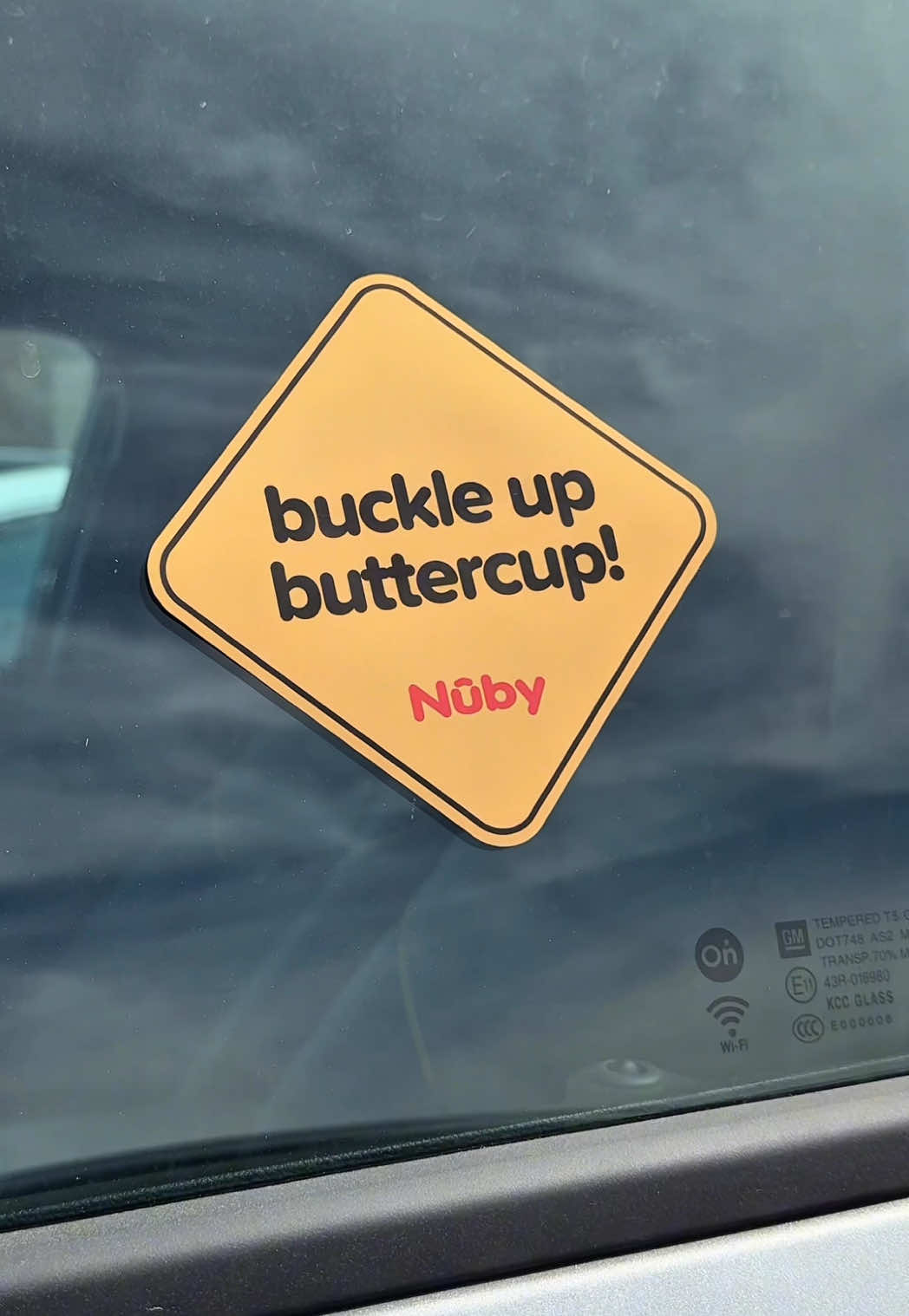 A post by @nuby on TikTok caption: Let's goooo!!!...🏃🚦🚗 It's safe to say, something BIG is coming to @target. We at the Nûby office are so stoked that we decided to plaster bumper stickers across the parking lot. Any guesses on our biggest partnership yet? #buckleup #car seat #babysafety #meangirls #babytok #teaser #parenting #momlife #targetmusthaves #comingsoon #safety #babylove 