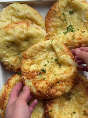 A post by @kookmutsjes on TikTok caption: SOFT CHEESE ONION BREAD #food #recipe #bread #soft #cheese #onion #pizza #ramadan #iftar #fyp DOUGH 215 ml milk 12 g honey 7 g instant yeast (1 tablespoon) 1 medium egg 450 g flour 35 g unsalted butter 8 g salt (1⅓ teaspoon) CHEESE MIXTURE 225 g young cheese 100 g cheese spread TOPPING 75 g yellow onion (half a yellow onion) 200 g grated cheese 1 medium egg INSTRUCTIONS In a deep bowl, combine the lukewarm milk, honey, and yeast. Mix well and let rest for 5 minutes. Add the beaten egg and mix well. Then add the butter, flour, and salt. Knead the dough for 10-12 minutes until smooth. Cover and let rise in a warm place for 1 hour or until the dough has doubled in size. Grind the young cheese (225 g) together with the cheese spread in a food processor until smooth. Divide the cheese mixture into 6 equal portions. Peel and slice the yellow onion into half-rings. Place them in a deep bowl along with the grated cheese (200 g). Mix well and set aside. Deflate the dough and divide it into 6 equal pieces of about 125 g each. Shape into balls. Take one ball and roll it into a flat circle. Place a portion of the cheese mixture in the center. Fold the dough around the filling and shape it into a firm ball, ensuring the seams are well sealed. Place the ball seam-side down. Slightly flatten the dough. Place the dough on a baking sheet lined with parchment paper. Brush with a beaten egg and sprinkle the onion-cheese mixture on top. Let rise for 30 minutes or until doubled in size. Preheat the oven to 200 °C (400 °F). Bake for 12-18 minutes or until golden brown. Tips:   Make sure the milk is lukewarm (around 35-40°C). If it's too hot, it can kill the yeast, and the dough won't rise properly. Cover the dough and place it in a draft-free, warm spot (like an oven with only the light on). Let the dough rise sufficiently. If you bake them too soon, they won’t be as airy. Wait until they’ve truly doubled in size. Every oven is different! If your bread browns too quickly, you can lower the temperature to 180-190°C.   A firmer young cheese melts better and creates a creamy, but not too runny, filling.