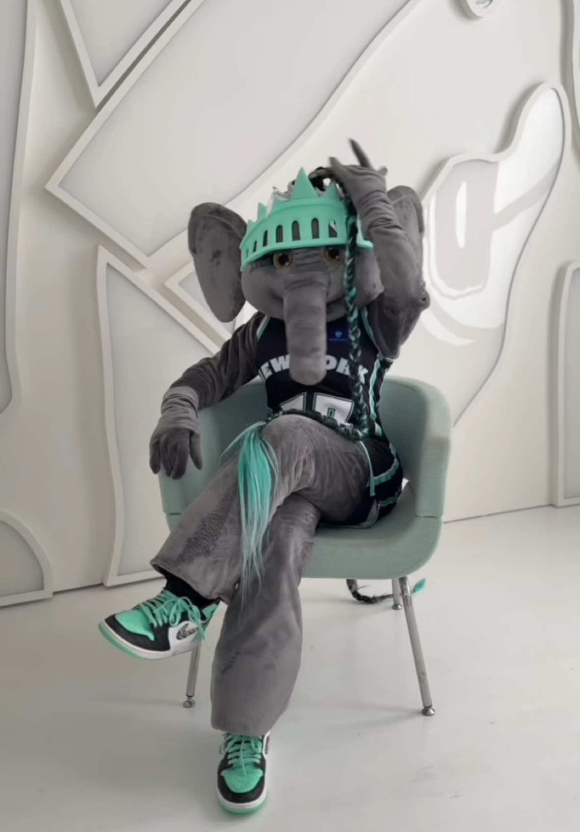A post by @bigellieliberty on TikTok caption: Since you got your DEGREE and you know EVERYTHING… LETS TALK ABOUT IT. 🪑 💅 🐘 #nyliberty🗽🏀 #wnba #ellietheelephant #fyp @nyliberty 