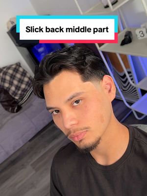 A post by @ivanthegreat86 on TikTok caption: Hair transformation on wavy hair 💇🏻‍♂️ try this brush back or slick back look with a middle part next time you see your barber #dallasbarber #fortworthbarber #menshairstyle #hairtransformation #curly #midtaper 