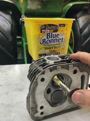A post by @tractorguy2022 on TikTok caption: Not to worry, im a trained proffessional…#dieselmechanic#tractorguy#johndeere