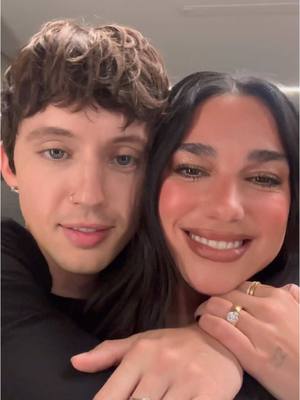 A post by @dualipaofficial on TikTok caption: 5 YEARS OF FUTURE NOSTALGIA ~ doesn’t even feel real!!!! Thank you for the memories that I have to last me a lifetime ~ keeping me dancing all around the world 🌎 🩷 grateful beyond words and thanking my lucky stars every day for music and the power that it has over me and the ability that it has had time and time again to connect us all no matter where we are on this floating rock!!!! To celebrate this massive milestone in my life I’m sharing a version of Physical that @Troye Sivan and I worked on together years ago and it always felt like it needed an occasion and this feels like it’s the perfect time. OUT MIDNIGHT TONIGHT 💿 💗 with love, always xx