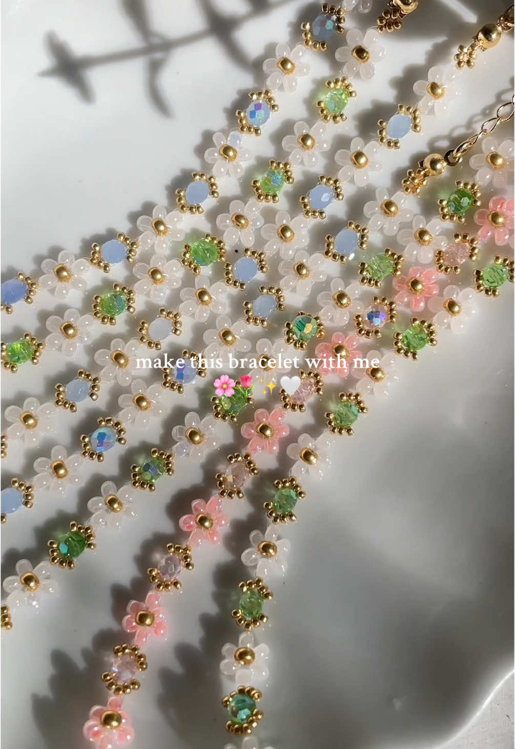 A post by @bijouxlasotita on TikTok caption: Floral energy only 🌷🌸✨ #SmallBusiness #handmadejewelry #handmadejewelrybusiness #beadedjewelry #beadedbracelets #canadiansmallbusiness #packingorders 