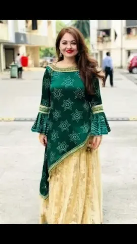A post by @gigiframe on TikTok caption: As a child, she was bullied for her unconventional looks. And then what happened?