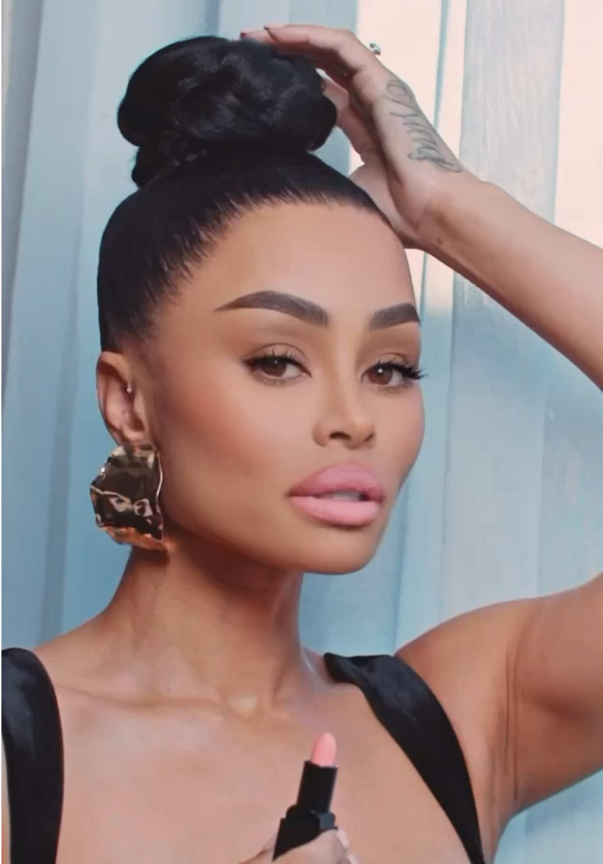 A post by @blacchyna on TikTok caption: @heartspurecosmetics offers 11 gorgeous shades of Matte Lipsticks you'll adore. Wearing “Brat” www.HeartsPureCosmetics.com