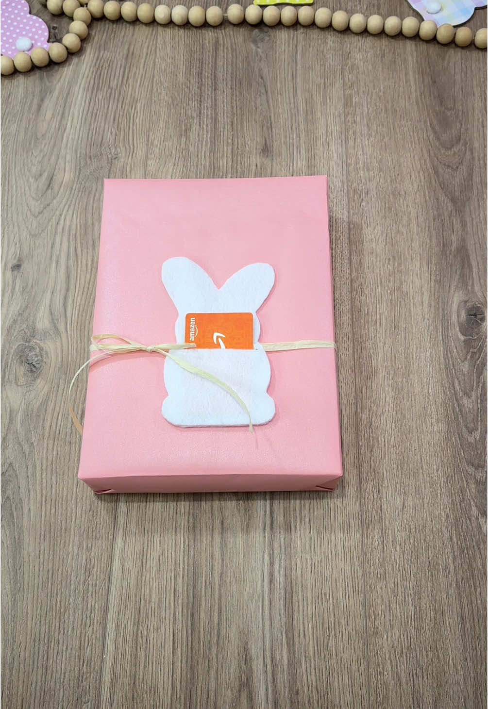 A post by @beeandblooms on TikTok caption: Cute way to add a gift card holder to a gift 🐰 follow me on IG for more #beeandbloomswraps #wrappinggifts #giftwrapping 
