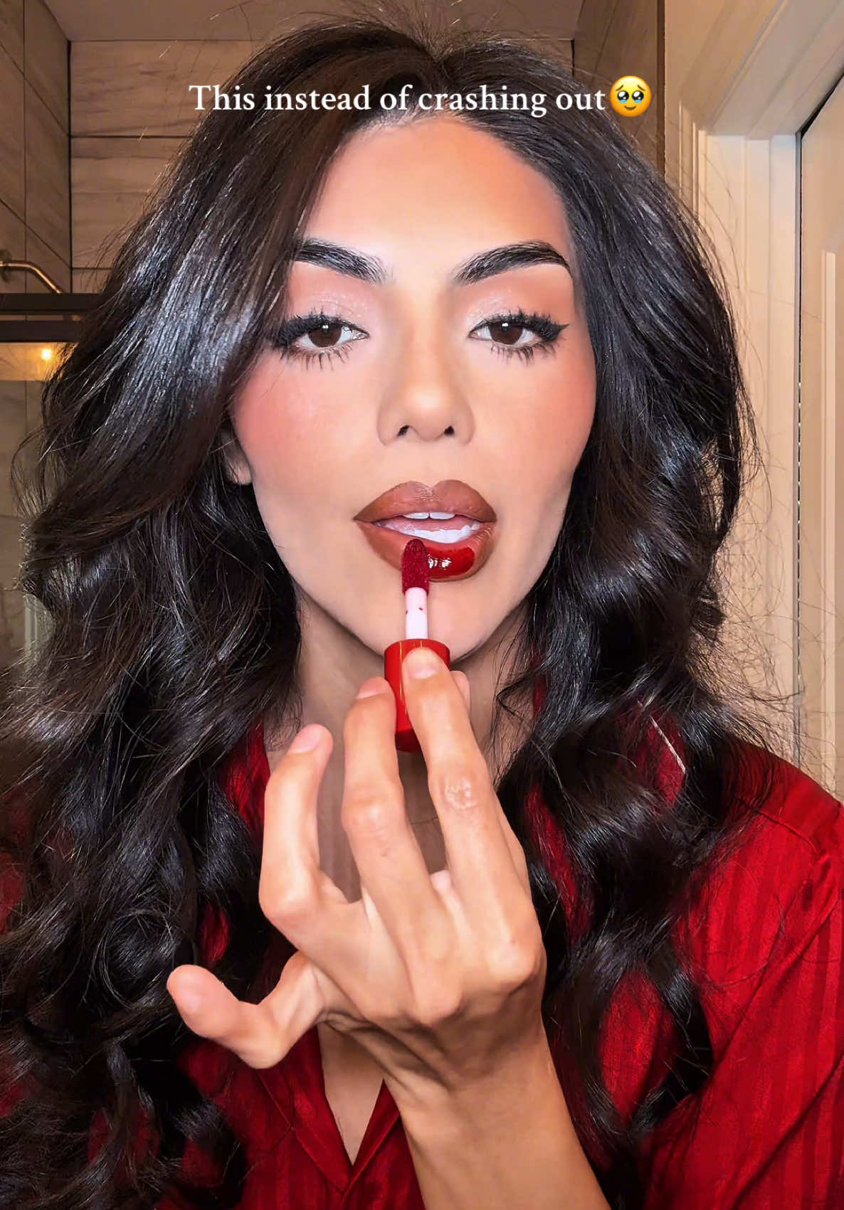 A post by @vraamosmakeup on TikTok caption: Sometimes little glam is all you need #latinamakeup #rarebeauty #redlip #rarebeauty 