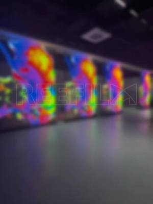 A post by @reefilm_display on TikTok caption: Here come the big cats, our transparent screen let's you switch any content seamlessly. #glass #ledscreen #reefilm #leddisplay #hottest #transparent #install #china #panel #ledfilm 