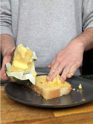 A post by @vlogcast on TikTok caption: I’ve been doing this wrong for years #butter #toast #LifeHack #fyp 