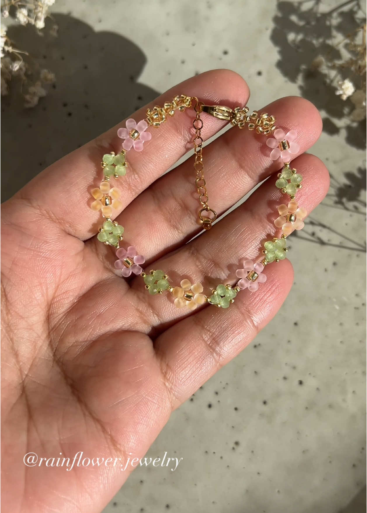A post by @rainflower.jewelry on TikTok caption: I'm feeling so inspired by the arrival of spring—its warmth and beauty🌸🌱✨ A new bracelet set in a fresh spring style is now available in my shop with free shipping! (Link in bio)🤍 #springbracelet #floraljewelry #beadedbracelet #handmadejewelry #bohostyle #aestheticaccessories #braceletstack #springvibes #natureinspired #cottagecoreaesthetic #SupportSmallBusiness #trendyjewelry #viralfinds #fyp #giftideas #musthaveaccessories #freeworldwideshipping 