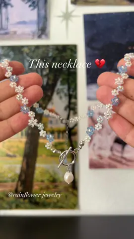 A post by @rainflower.jewelry on TikTok caption: This is one of the custom orders I absolutely loved making! I’m honestly obsessed with this design, and creating this necklace was pure joy🤍✨ A beautiful floral necklace with blue and moonstone beads, accented with silver, is now available on my website with free shipping! (Link in bio)🌱 #customjewelry #handmadenecklace #floraljewelry #beadedjewelry #moonstonevibes #blueaesthetic #bohoaccessories #cottagecorestyle #daintyjewelry #jewelrytrends #aestheticfashion #SupportSmallBusiness #shopsmall #uniquegifts #trendyjewelry #fyp #viralfinds #freeworldwideshipping 