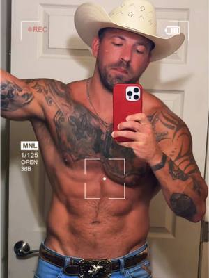 A post by @nottattedfire on TikTok caption: Thirsty Thursday #cowboy #wrangler #muscle #tattoos #BookTok #abs #model 
