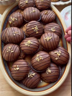 A post by @kookmutsjes on TikTok caption: WALNUT CRUMBLE COOKIES WITH CHOCOLATE #food #recipe #cookies #chocolate #walnuts #fy #fyp #foryoupage #chocolate COOKIE DOUGH 135 g unsalted butter 8 g vanilla sugar (1 sachet) 100 g granulated sugar 200 g walnuts 100 g milk chocolate 200 g all-purpose flour 3 g baking powder COATING 300 g milk chocolate 20 ml sunflower oil GARNISH 40 g dark chocolate walnuts Instructions: Melt the butter in a saucepan over low heat. Let it cool. Finely chop the walnuts in a food processor. Finely chop the milk chocolate (100 grams) in a food processor. In a bowl, mix the cooled butter, vanilla sugar, and granulated sugar. Add the chopped walnuts, milk chocolate, flour, and baking powder. Knead until smooth. Take 14 grams of the cookie dough and shape it into a ball. Place the balls on a baking sheet lined with parchment paper. Preheat the oven to 200 °C (400 °F). Bake the walnut cookies for 10-12 minutes. Remove from the oven and let them cool completely to firm up. Melt the milk chocolate (300 grams) with the sunflower oil (20 ml) using a double boiler. Dip the cooled walnut cookies one by one into the melted milk chocolate and place them on a sheet of parchment paper. Melt the dark chocolate using a double boiler and transfer it to a piping bag. Drizzle thin lines of dark chocolate over the cookies and sprinkle with chopped walnuts. Let the chocolate harden completely. Tips: Lightly toast the walnuts in a dry skillet before chopping for extra flavor. Make sure the melted butter cools down properly. If the butter is still warm, the cookie dough may  become too soft, affecting the cookie texture. If the cookie dough feels soft after kneading, refrigerate it for 15-20 minutes before shaping into balls.  This helps prevent excessive spreading during baking. Store the cookies in an airtight container in a cool place. They will stay fresh for a few days.