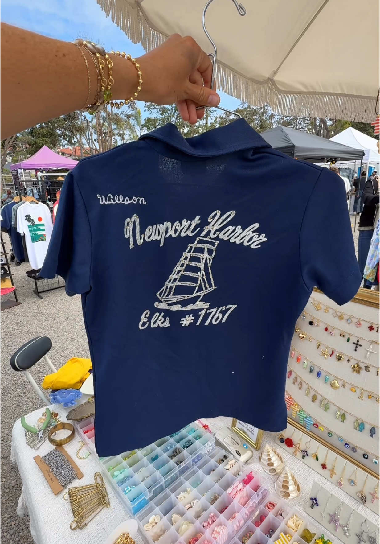 A post by @surfingskeletons on TikTok caption: Find us every Saturday + Sunday @Moonlight Marketplace 🐆🌴🐚✨ 10am-4pm at 459 S Coast Highway 101  • • • #fleamarket #customjewelry #italiancharms #vintagemarket #customcharms #charmssandiego #encinitascalifornia 