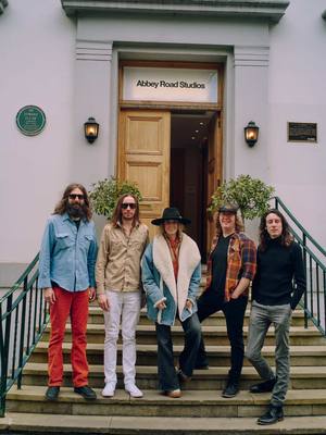 A post by @laineywilson on TikTok caption: Me and the band.. Abbey Road Studios.. 🎬 take 573… 🔔👖☝🏽 