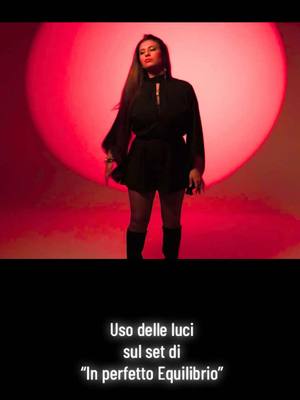 A post by @evareareal on TikTok caption: Trick luci in sala 🔴✨🟠 - sul set di “In perfetto Equilibrio” 🎬