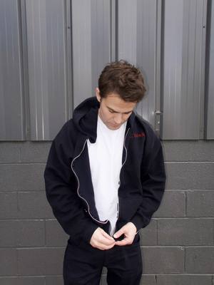 A post by @thepaulwesley on TikTok caption: New merch now available at paulwesley.shop and link in my bio  @Blank clo 