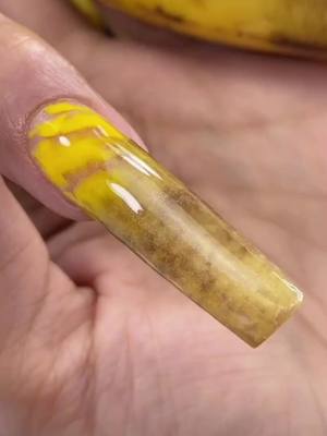 A post by @ilysmnails on TikTok caption: Real Banana Nail 🍌 ilysmnails . com 💅🏽 Extending my Nail with a Real Banana Peel! Will it work out? #onthisday #nails #nailart #satisfying #beautyhacks 