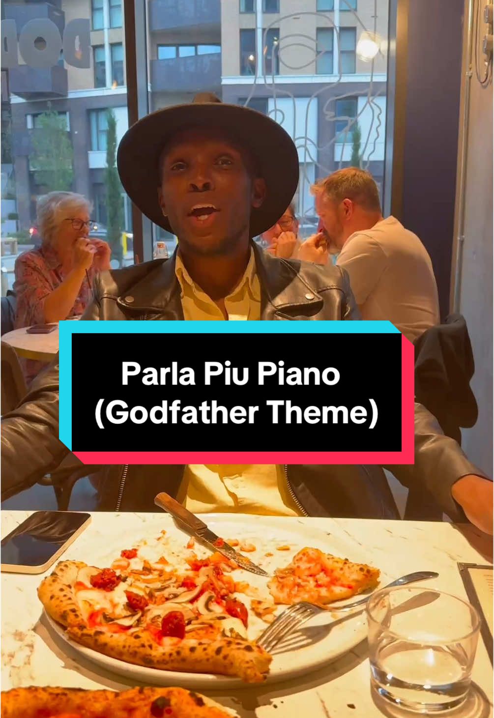 A post by @juliencohen_piano on TikTok caption: AMAZING Tenor joins me in Restaurant singing Godgather Theme 😍 With BGT finalist @innocentmasukuofficial ! 🎶: Parla Piu Piano (theme originally composed by Nino Rota)
