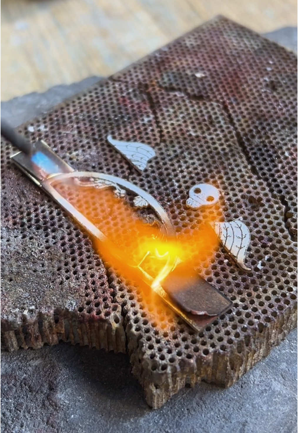A post by @redmothjewelry on TikTok caption: Winged Death Head Ring #metalsmith #silversmith #handmade 