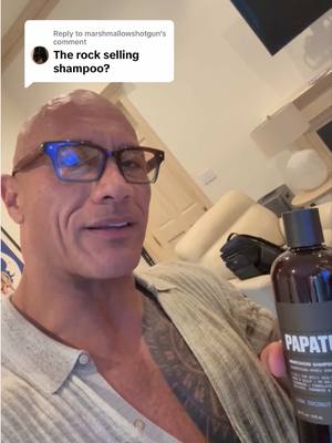 A post by @therock on TikTok caption: Replying to @marshmallowshotgun You MF’s are funny 😂👏🏾👏🏾 I may not have hair (by CHOICE!:) but YOU do.  Now shut up and enjoy your shampoo + conditioner! 🤣🫧🚿  @Papatui #takebettercare 
