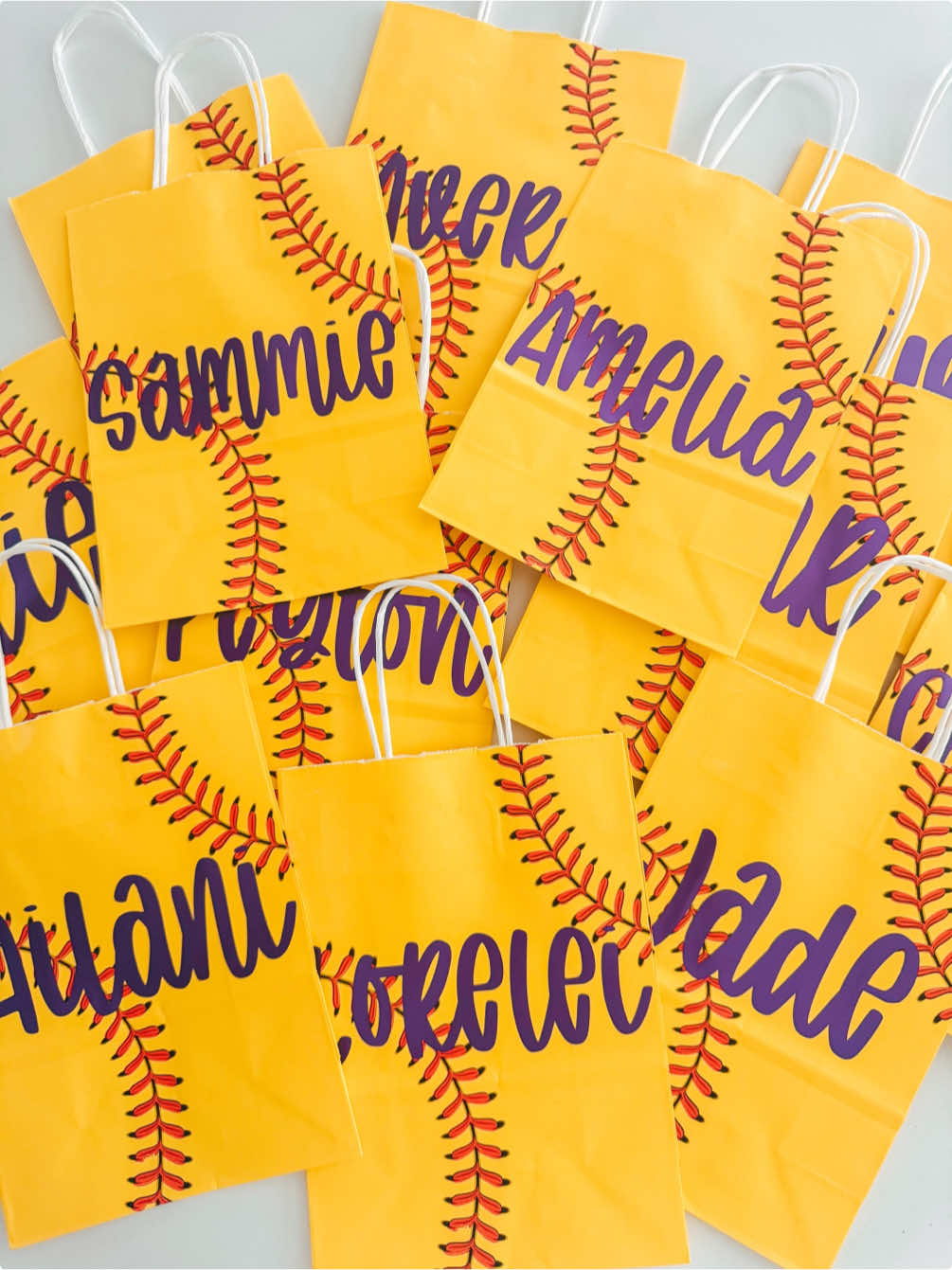 A post by @threepairsofears on TikTok caption: Decorate some softball goodie bags with me using permeant adhesive vinyl 🥎💜 … #smallshop #smallshops #smallbusiness  #threepairsofears #asmr #asmrvideo #siser  #siserjuliet  #siserna   #crafting #crafts #diy #crafter  #permanentadhesivevinyl #craftvinyl #softball 