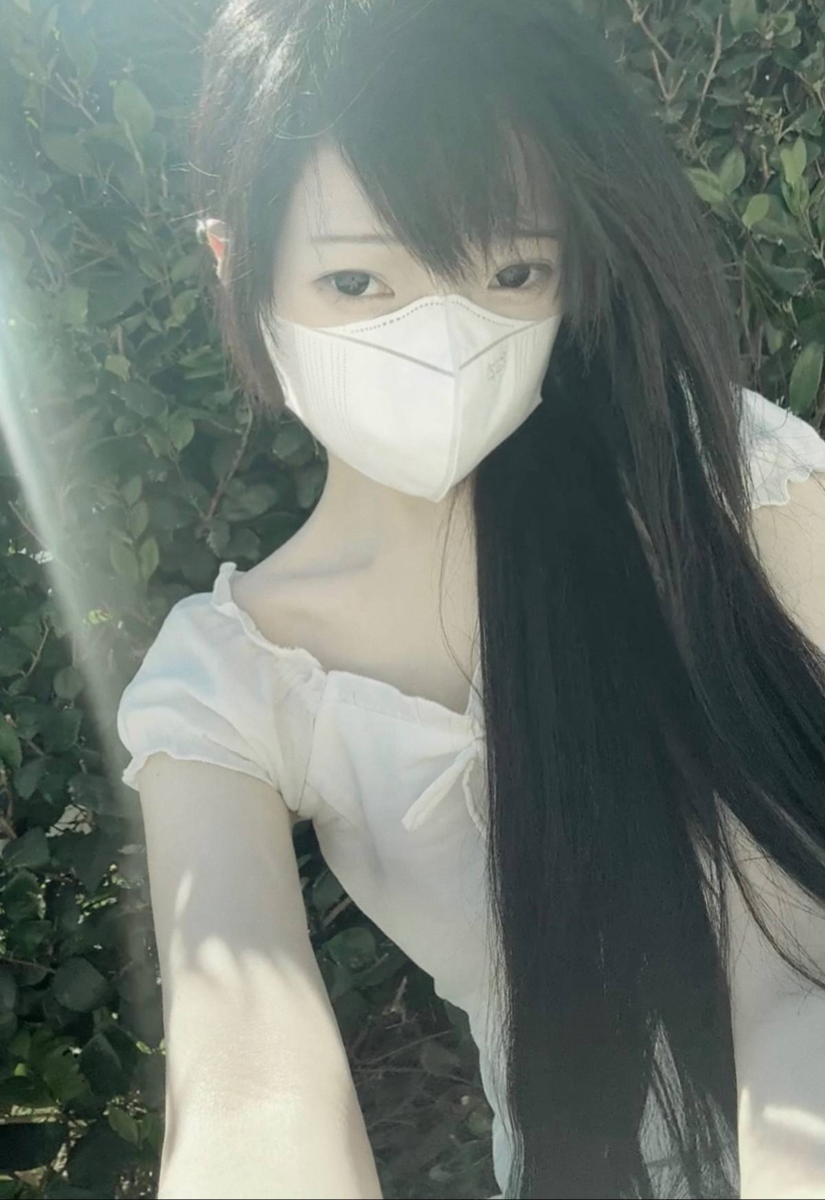 A post by @nwkooo on TikTok caption: i find beauty in a colorless world #flowers #cherryblossom #outfit #hair #makeup #birds #nature 