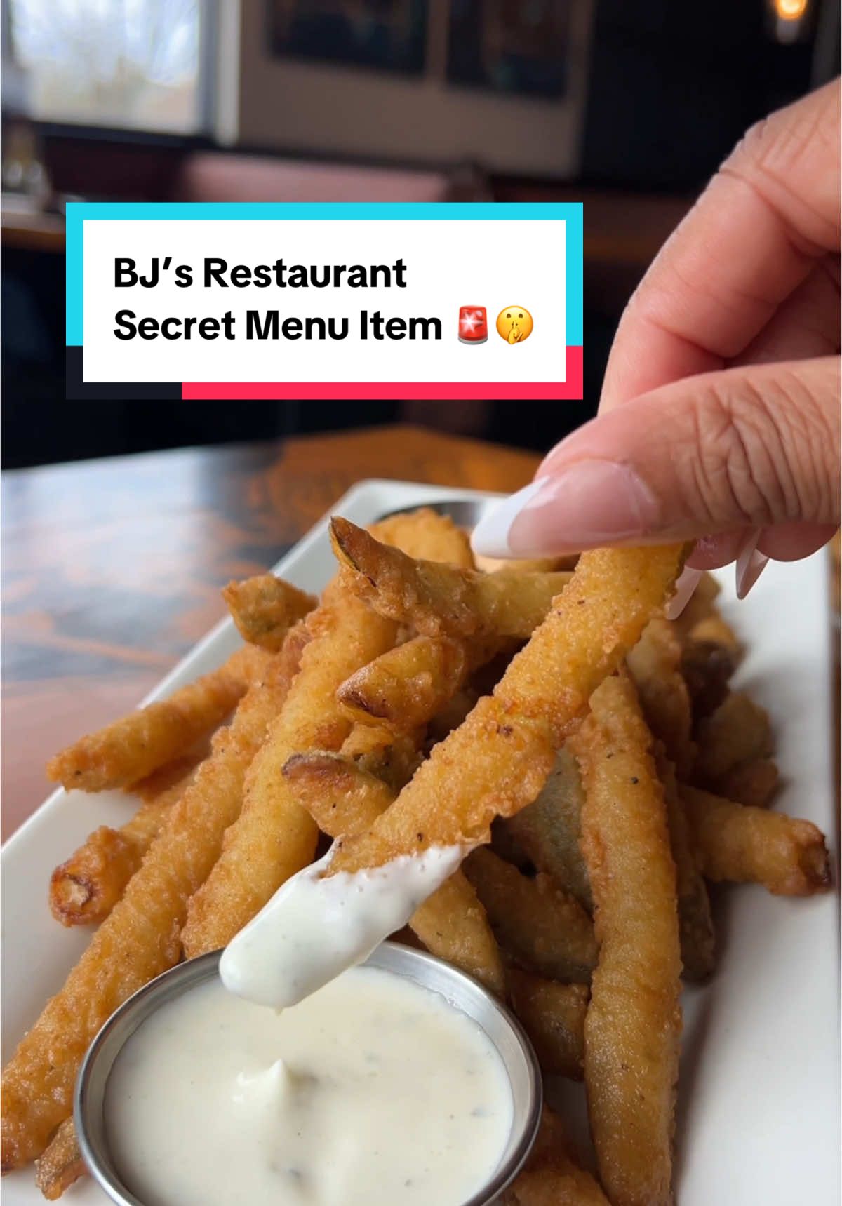 A post by @dasseats on TikTok caption: Shhh… I’ve got a secret 🤫  @bjsrestaurants just dropped one of the most anticipated items right now— fried pickles! But you won’t find this secret menu item without knowing what to ask for—  𝙁𝙧𝙮𝙘𝙠𝙡𝙚 𝙁𝙧𝙞𝙚𝙨 🔥  Head to your local BJ’s to fulfill your fried pickle cravings! But don’t sleep… these might not be around for long.  #bjspartner#frycklefriess #secretmenu #hiddengem #dmvfoodie #bjsrestaurant 