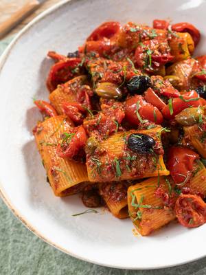 A post by @giallolovesitaly on TikTok caption: 🔥 Spicy, salty, savory heaven!😋 This rigatoni with N’duja, roasted cherry tomatoes, capers, olives & anchovies hits ALL the flavor notes😍 Bold Calabrian vibes in every bite🍝🌶️ @alberto_marcolongo @cookwithfez Ingredients: 3 ⅓ cups rigatoni (320 g) 3.5 oz N'duja (100 g) ½ cup pitted Taggiasca olives (80 g) 4 salted anchovy fillets 2 ½ tablespoons salted capers (rinsed) (40 g) 1 bunch fresh parsley, finely chopped 1 garlic clove 5 ½ cups cherry tomatoes, halved (800 g) ⅔ cup dry white wine (150 ml) Extra virgin olive oil, to taste Salt, to taste  Pepper, to taste #giallolovesitaly #pasta #foodtok